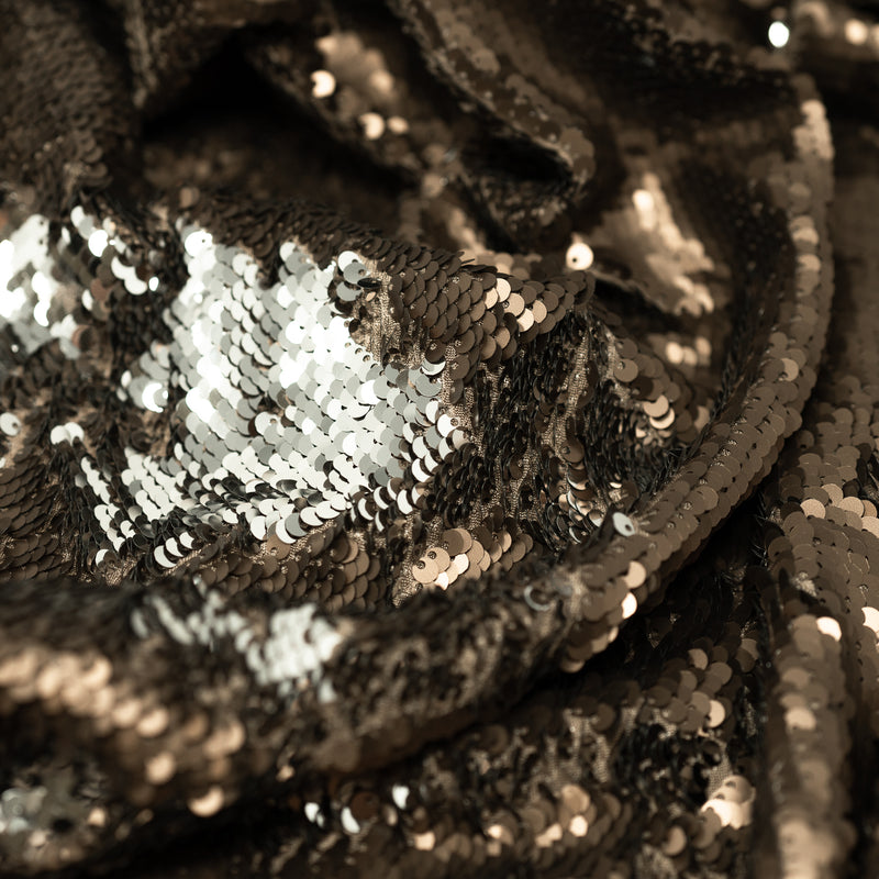 A crumpled piece of Brown and Silver Flip Sequin on Spandex