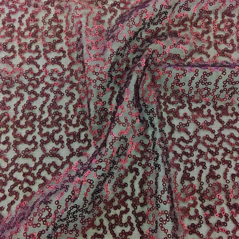 A swirled sample of caviar dreams stretch mesh sequin in the color burgundy.