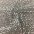 A swirled sample of caviar dreams stretch mesh sequin in the color grey-silver.