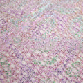 A flat sample of centerstage foiled stretch netting in the color lavender.