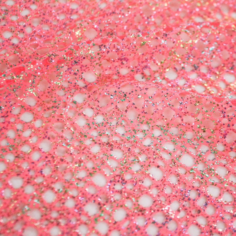 A flat sample of centerstage foiled stretch netting in the color watermelon.
