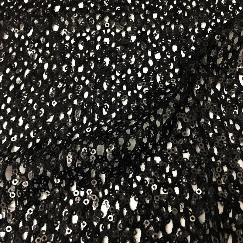 A flat sample of cersei stretch lace sequin in the color black.
