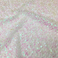 A flat sample of cersei stretch lace sequin in the color white-pearl.
