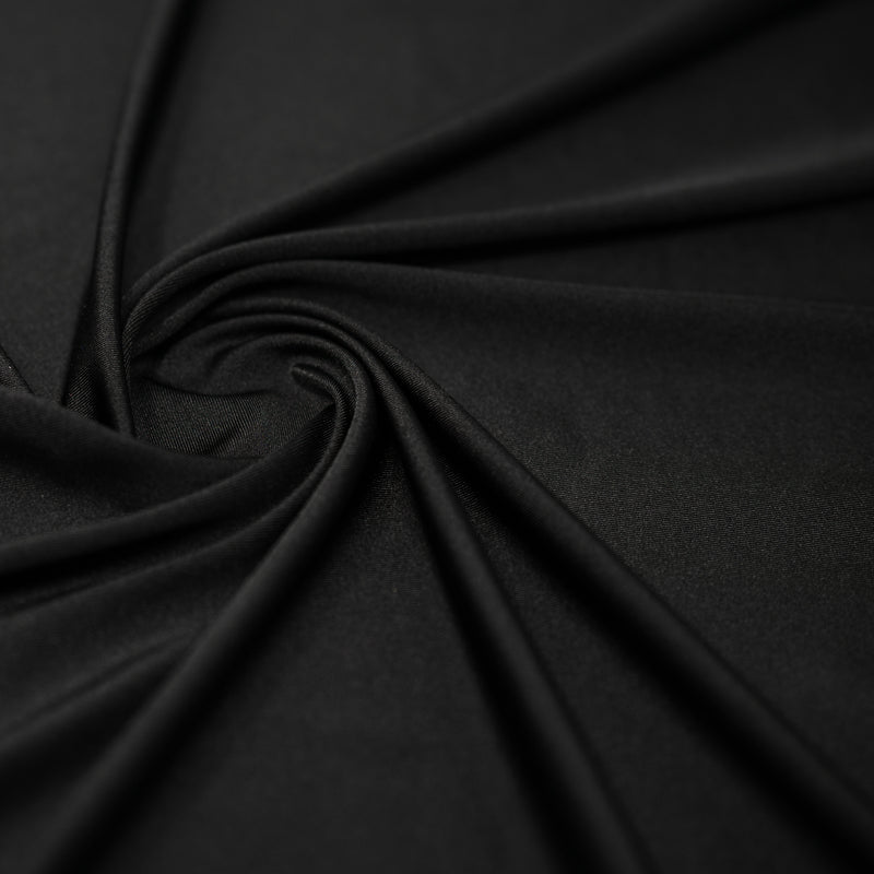 A swirled sample of Charisma shiny nylon spandex in the color Black