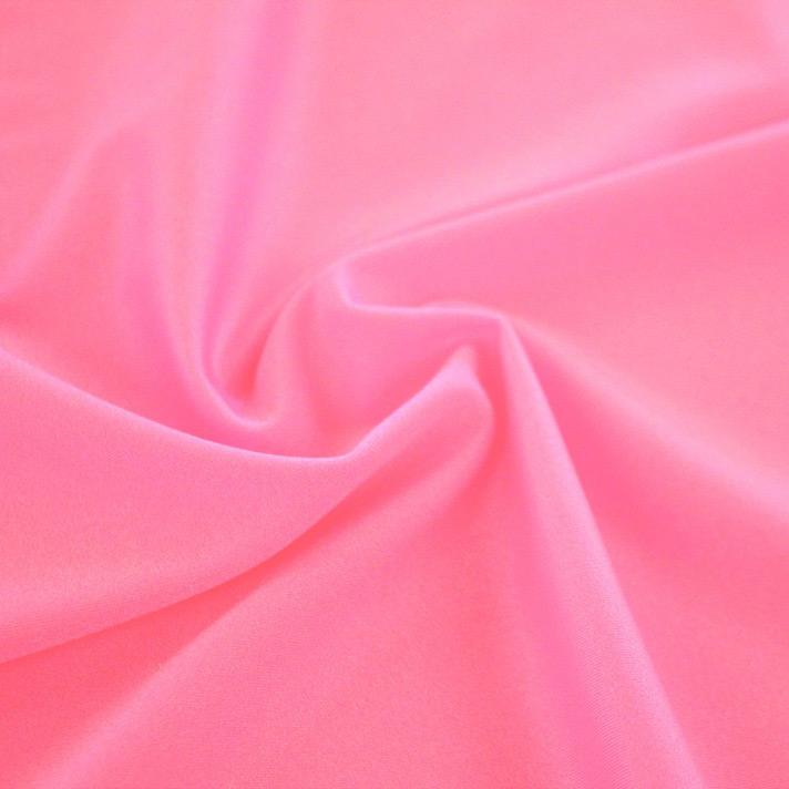 A swirled sample of Charisma shiny nylon spandex in the color hot pink.