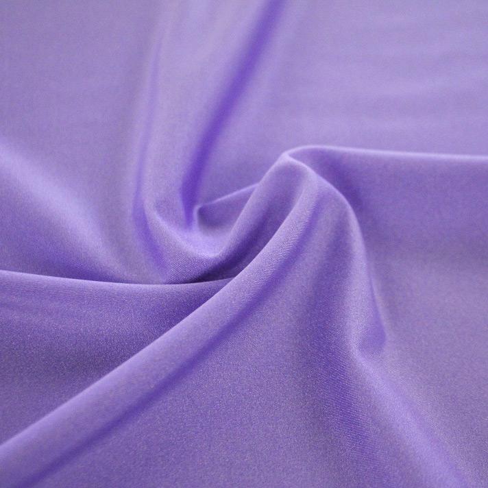 A swirled sample of Charisma shiny nylon spandex in the color viola.