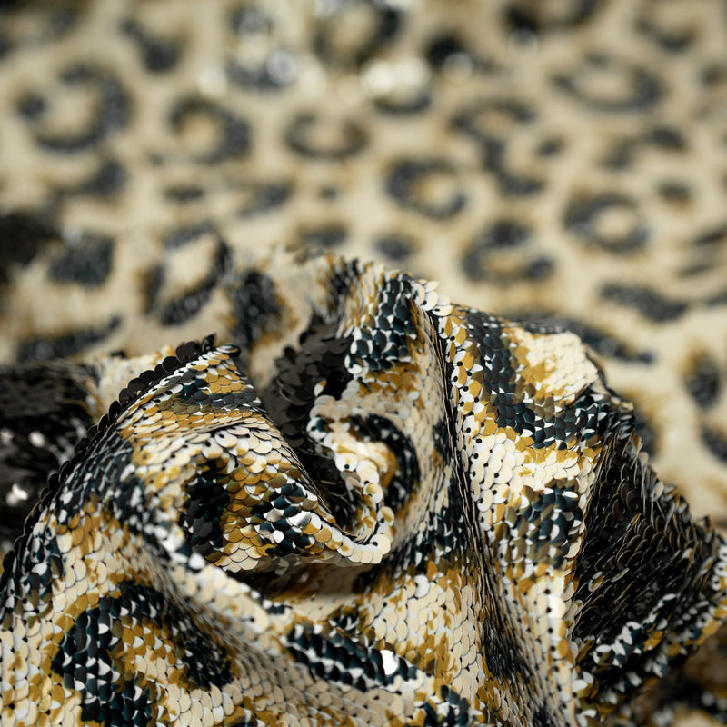 A crumpled piece of Cheetah Printed Flip Sequin on Spandex