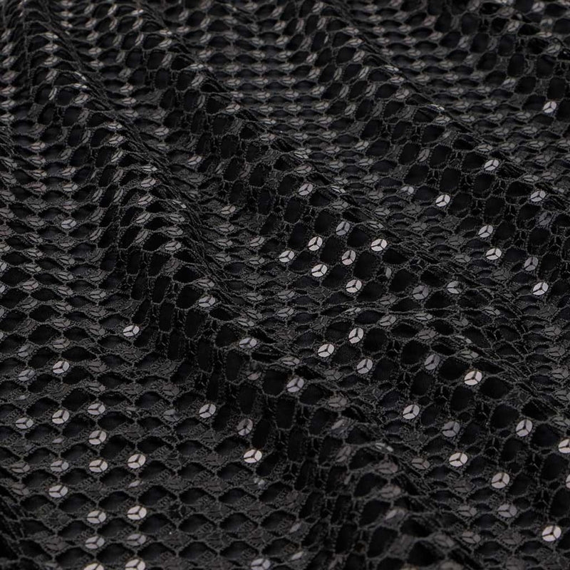 A flat sample of chequered knitted lace sequin in the color black.