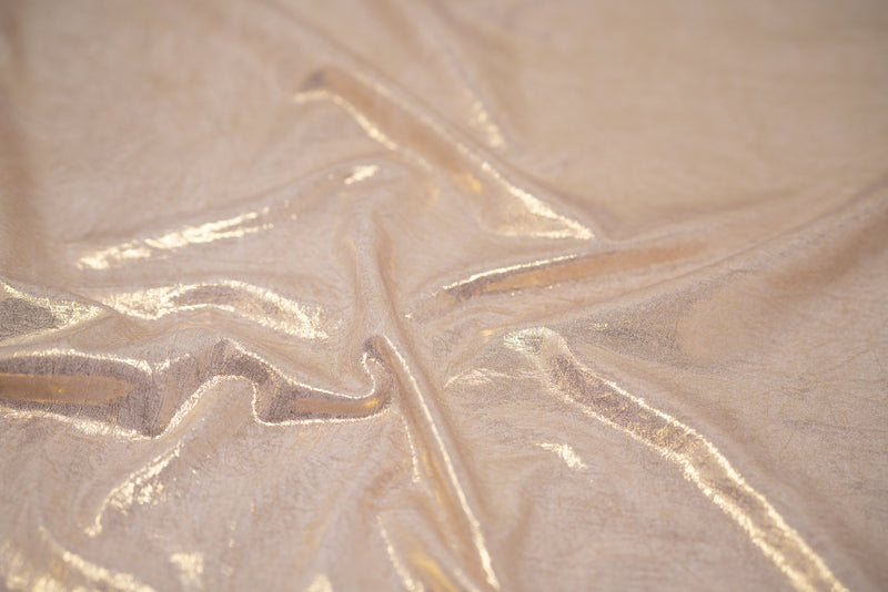 Detailed shot of Claudette Creased Foiled Spandex Fabric in color Ivory/Gold.