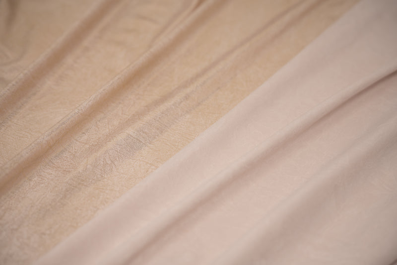 Detailed shot of front and back of Claudette Creased Foiled Spandex Fabric in color Ivory/Gold.