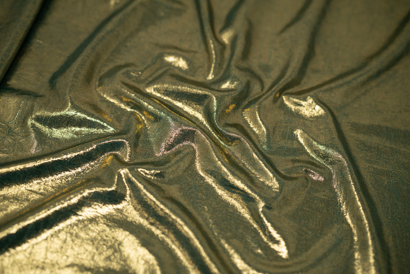 Detailed shot of Claudette Creased Foiled  Spandex Fabric in color Forest-Gold