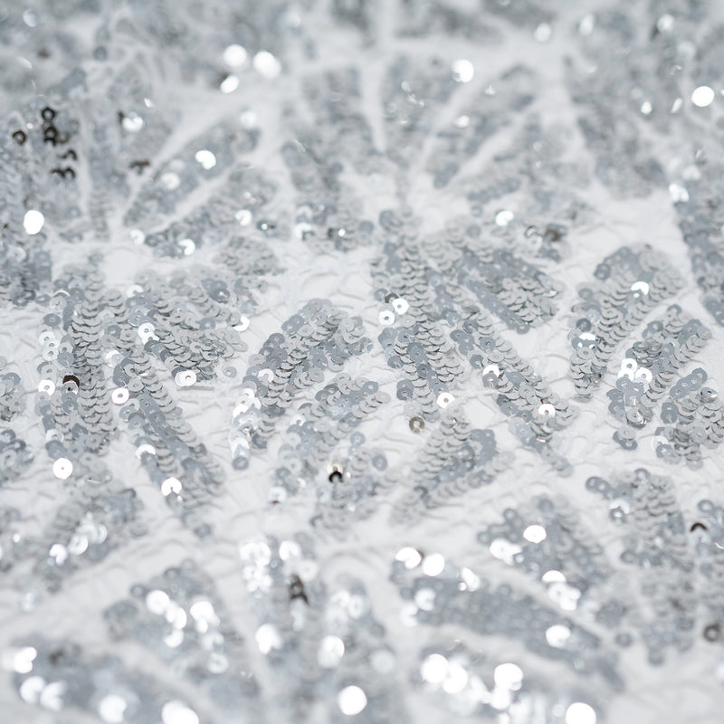A flat sample of cluster lace sequin in the color White-Silver.