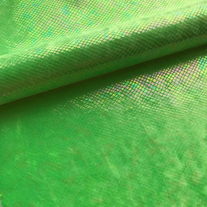 A folded sample of cobra foil printed stretch velvet in the color lime.