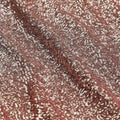 A flat sample of cosmic spandex sequin in the color champagne available at blue moon fabrics.