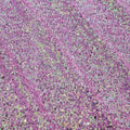 A flat sample of cosmic pearl stretch spandex sequin in the color black-rasberry available at blue moon fabrics.