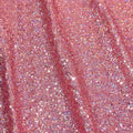 A panel of Cosmic GLOW spandex sequin in dark pink available at Blue Moon Fabrics.