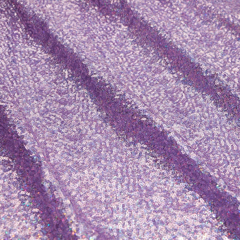 A panel of Cosmic GLOW spandex sequin in lilac available at Blue Moon Fabrics.