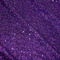 A panel of Cosmic GLOW spandex sequin in purple available at Blue Moon Fabrics.
