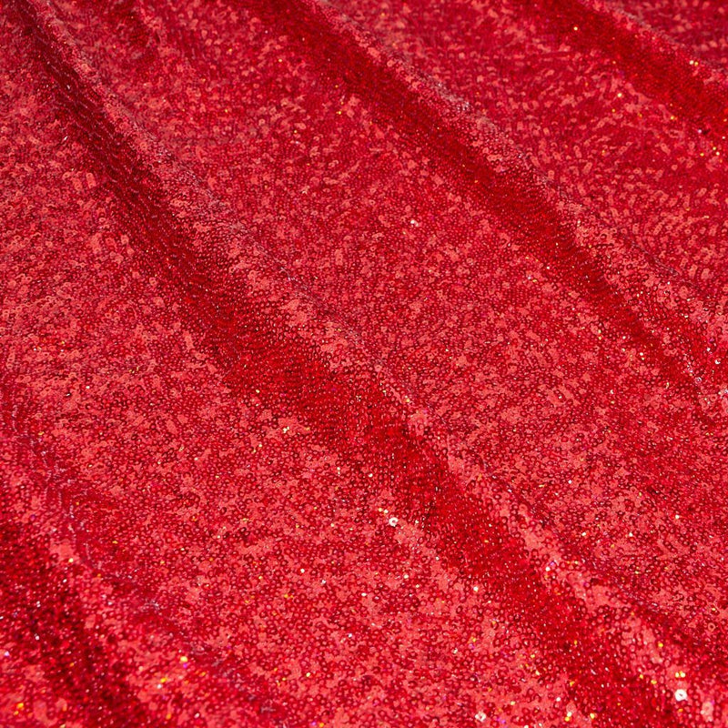 A panel of Cosmic GLOW spandex sequin in red available at Blue Moon Fabrics.