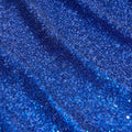 A panel of Cosmic GLOW spandex sequin in royal available at Blue Moon Fabrics.
