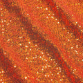 A flat sample of cosmic spandex sequin in the color orange available at blue moon fabrics.