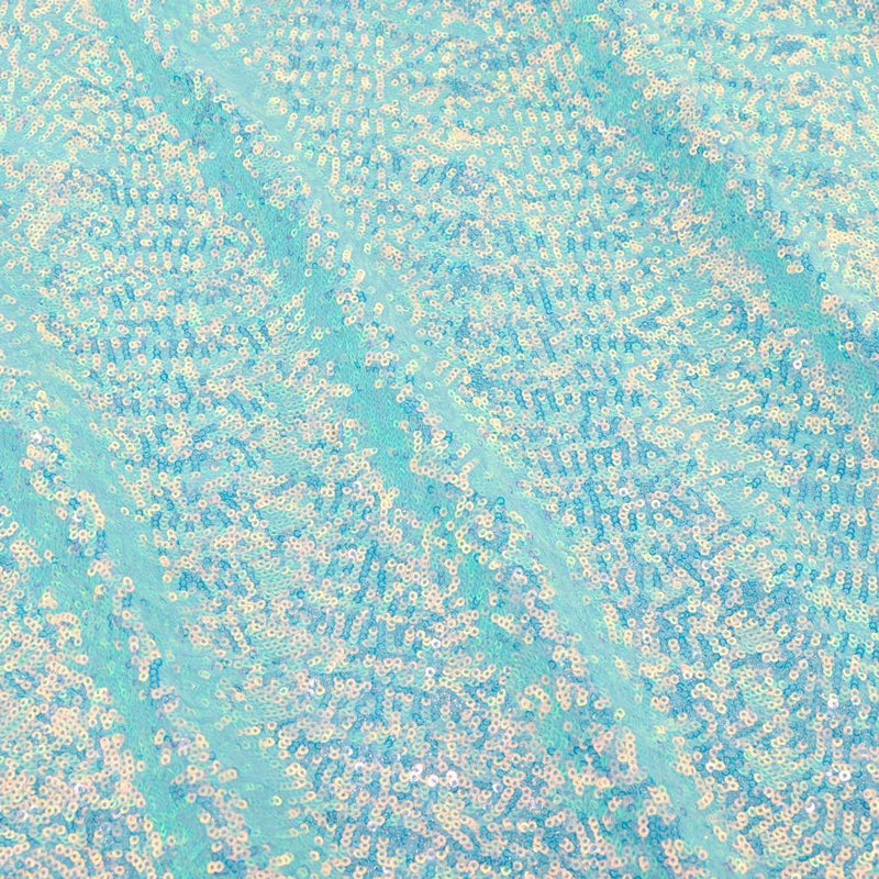 A flat sample of cosmic pearl stretch spandex sequin in the color baby blue available at blue moon fabrics.
