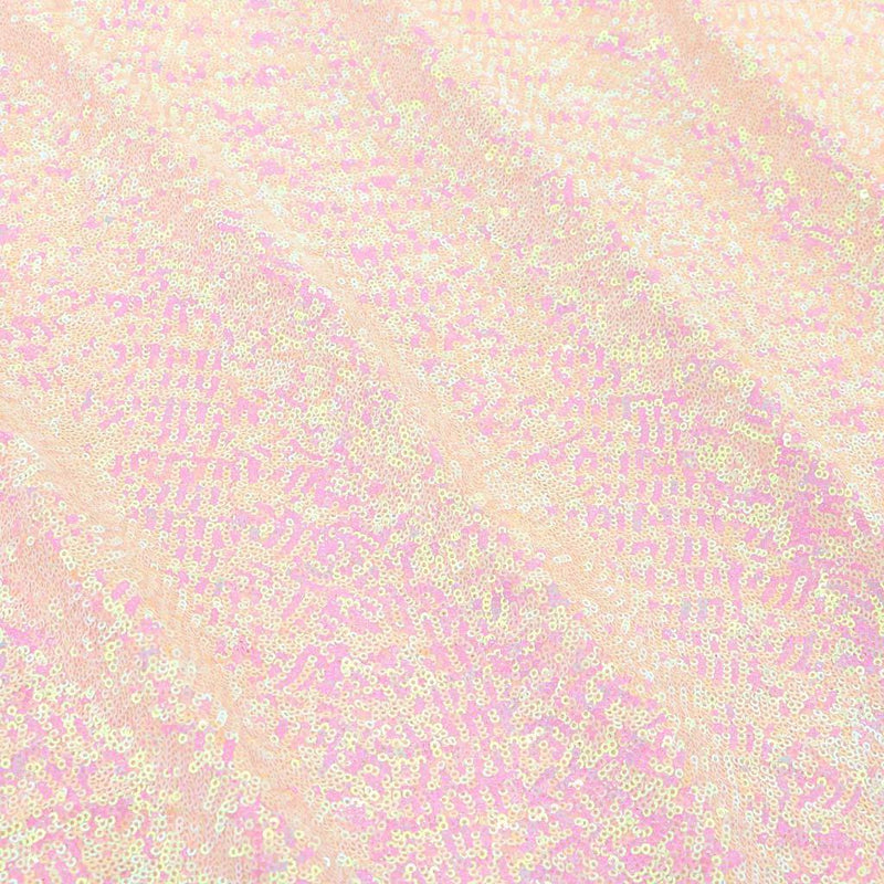 A flat sample of cosmic pearl stretch spandex sequin in the color baby pink available at blue moon fabrics.