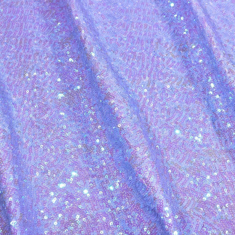 A flat sample of cosmic pearl stretch spandex sequin in the color lilac available at blue moon fabrics.