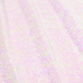 A flat sample of cosmic pearl stretch spandex sequin in the color warm white available at blue moon fabrics.