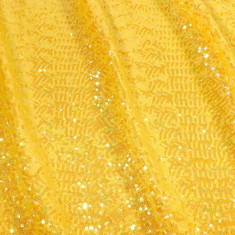 A flat sample of cosmic pearl stretch spandex sequin in the color yellow available at blue moon fabrics.