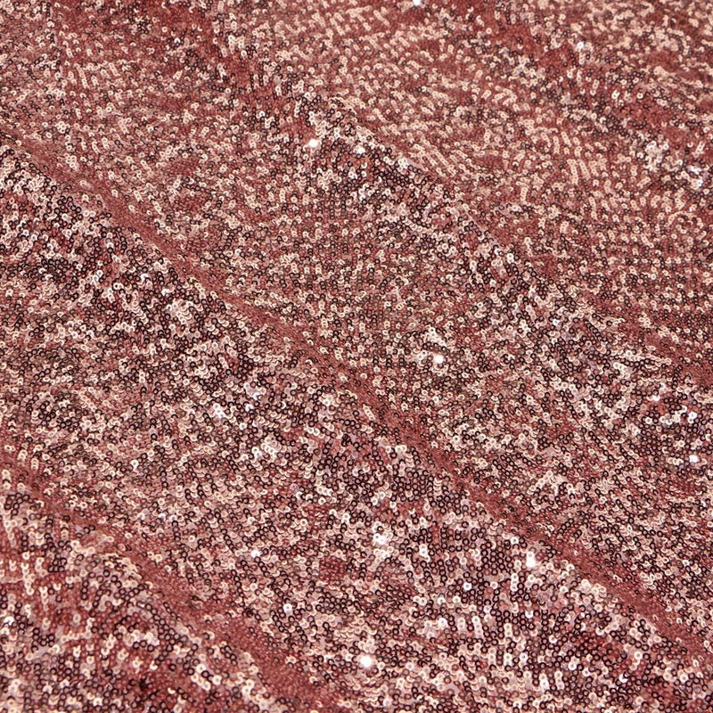 A flat sample of cosmic spandex sequin in the color pink available at blue moon fabrics.