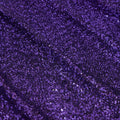 A flat sample of cosmic spandex sequin in the color purple available at blue moon fabrics.