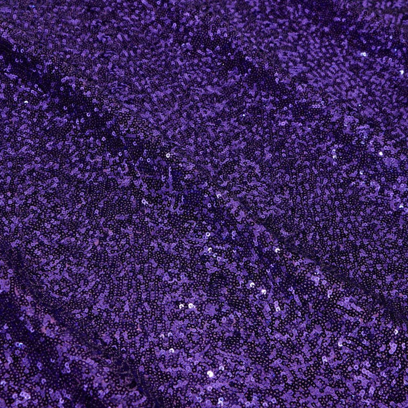 A flat sample of cosmic spandex sequin in the color purple available at blue moon fabrics.