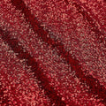 A flat sample of cosmic spandex sequin in the color red available at blue moon fabrics.