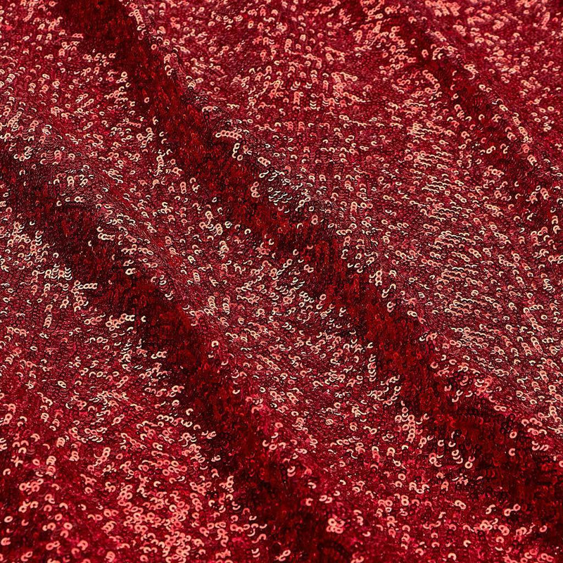 A flat sample of cosmic spandex sequin in the color red available at blue moon fabrics.