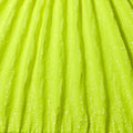A panel of Cosmic GLOW spandex sequin in  Neon Yellow available at Blue Moon Fabrics.