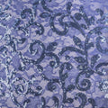 A flat sample of cottage garden stretch lace sequin in the color periwinkle available at blue moon fabrics.