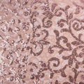 A flat sample of cottage garden stretch lace sequin in the color pink available at blue moon fabrics.