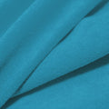 A folded piece of Cozy Polyester Spandex Terry Cloth in the color bahama mama.