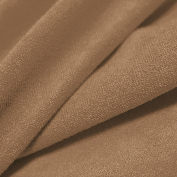 A folded piece of Cozy Polyester Spandex Terry Cloth in the color bashful.