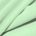 A folded piece of Cozy Polyester Spandex Terry Cloth in the color icicle.