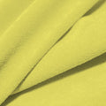 A folded piece of Cozy Polyester Spandex Terry Cloth in the color seagrass.