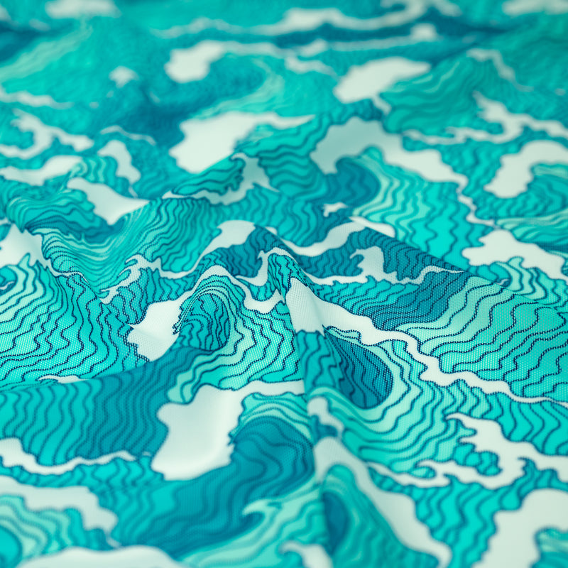 A crumpled piece of Crazy Waves Printed Power Mesh