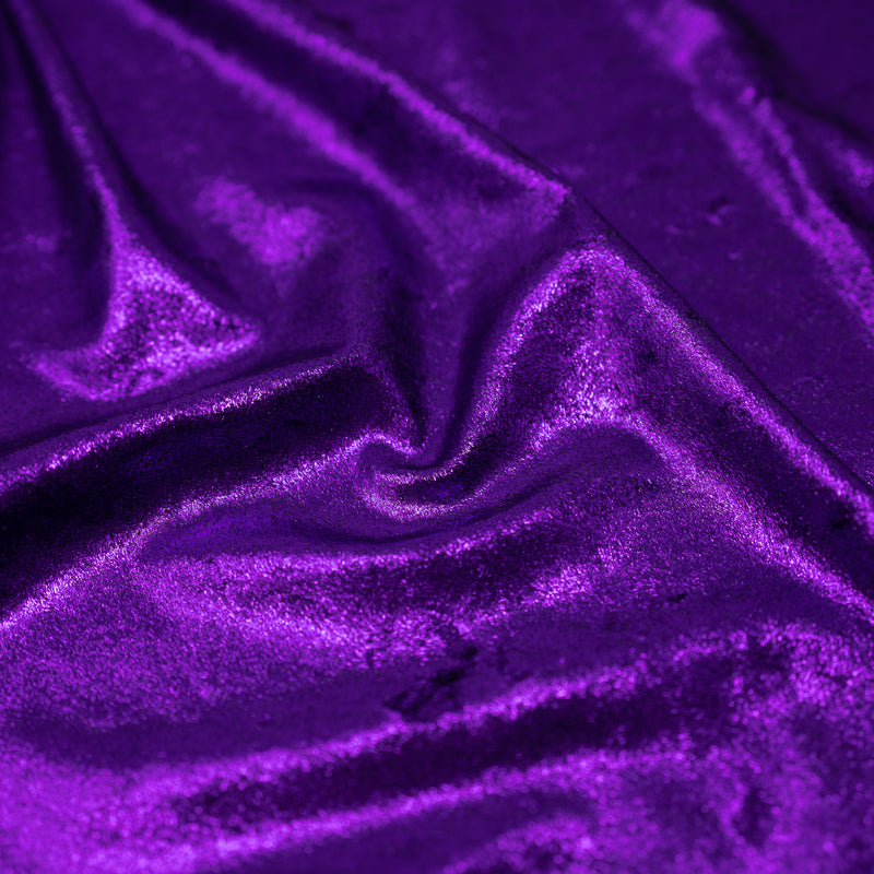A crumpled piece of D Isis Foiled Stretch Velvet in the color Black/Purple