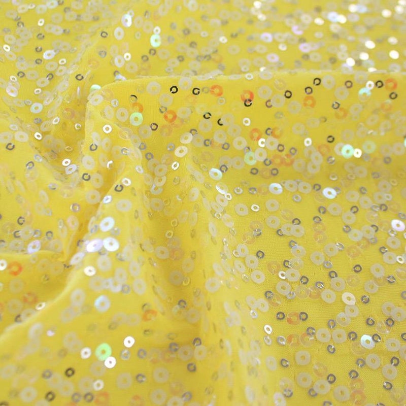A swirled sample of darling spandex sequin in the color yellow.