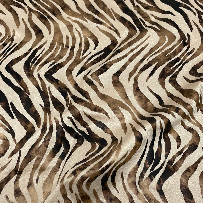 A flat sampele of desert zebra foil printed spandex in Skin Matte Foil.