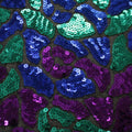 A flat sample of disco daze stretch mesh sequin in the color black-blue-purple.