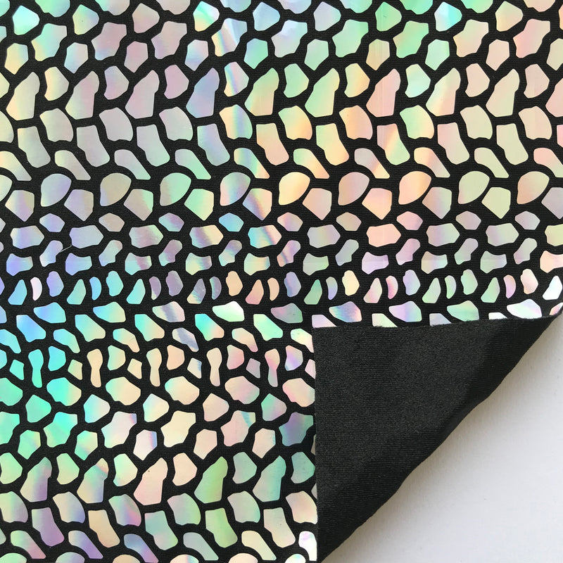 A flat sample of dragon scales holographic spandex sequin in the color black.