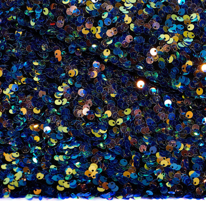 A flat sample of duchess stretch velvet sequin in the color black-blue-gold.