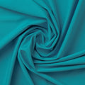 A swirled sample of EcoTechFlex recycled polyester spandex in the color Diva Blue